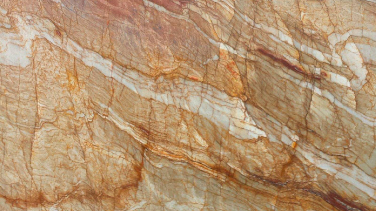 الكوارتزيت يتكوَّن من الحجر الرملي الذي يخضع لإعادة تبلور، فتتشابك حبيبات الكوارتز تشابُكاً يجعلها قوية وتأخذ شكل خطوط متموجة باللونين الرملي والابيض ومتماسكة.