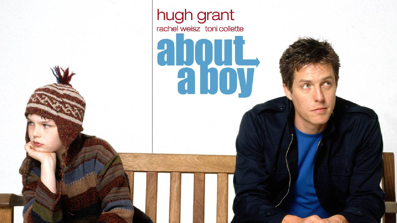 يظهر البطل هيو غرانت وهو جالس على مقعد خشي و في الطرف الآخر من المقعد يجلس طفل يضع قبعة صوفية وعلى الخلفية البيضاء اللصورة في المنتصف مكتوب اسم الفيلم باللون الازرق 