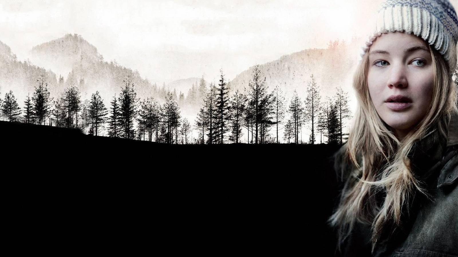 تظهر في الصورة فتاة شقراء ترتدي قبعة صوفية و بجانبها غابة من الاشجار على ارضية سوداء خلفها جبال وسماء رمايدية 