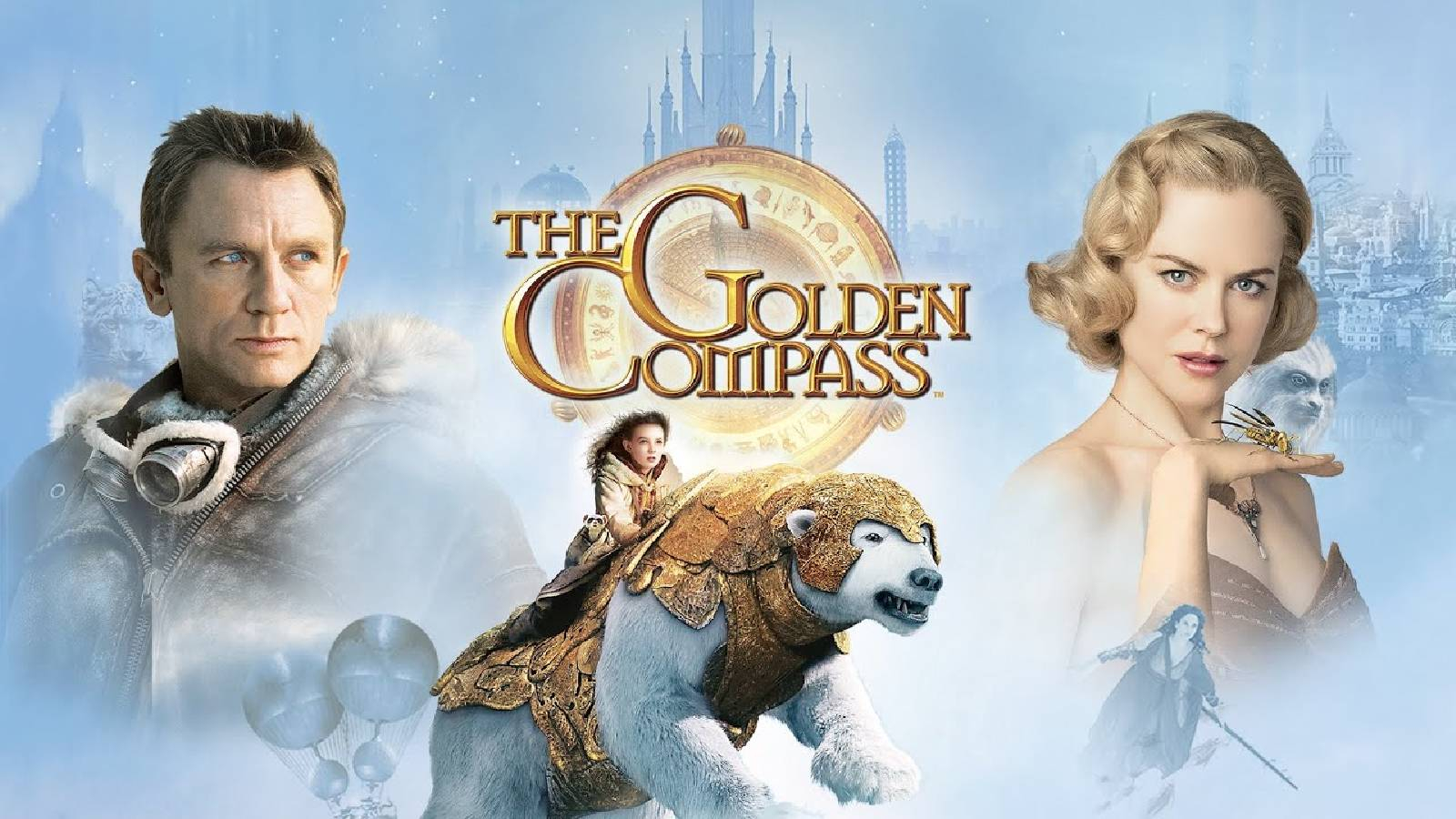 على خلفية ضبابية يظهر بطلي الفيلم على جانبي الصورة وفي الوصط بوصلة مكتوب فوقها The Golden Compass و تحتها دب ابيض تمتطيه فتاة
